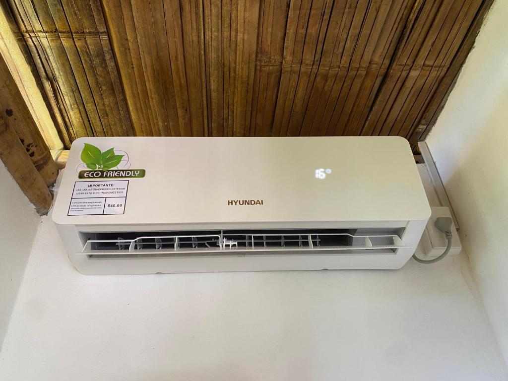 a laptop computer sitting on top of a printer at Bungalows Ayampe in Ayampe