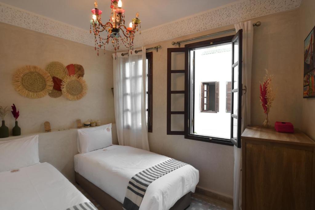 Postel nebo postele na pokoji v ubytování Riad Palau Marrakech