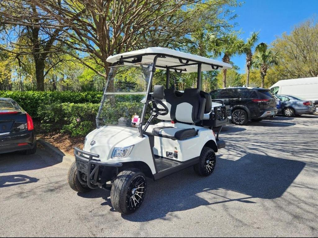 a golf cart parked in a parking lot at Pilot House 412 in Destin