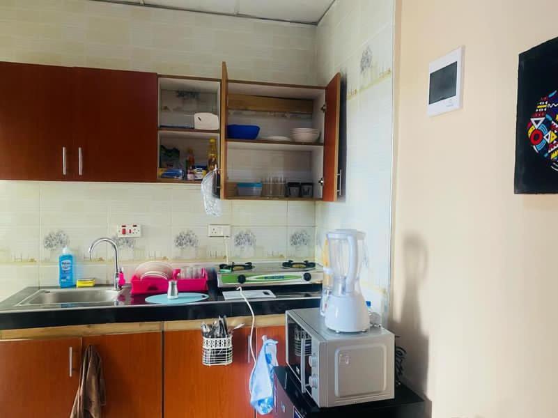 a kitchen with a counter with a blender on top of it at Paradise in Dar es Salaam