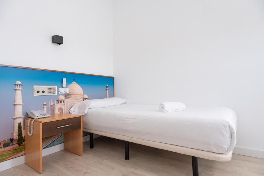 Posteľ alebo postele v izbe v ubytovaní Restaurante Hotel Abadesa