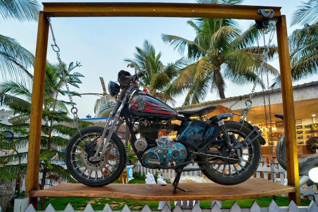 a motorcycle is hanging on a swing at Lacasita Villas & Cottages near Anjuna Beach & Shiva Valley in Anjuna