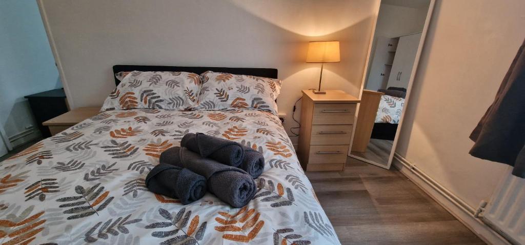a bedroom with a bed with two stuffed animals on it at Comfortable 2 bedrooms flat in Oval Central London in London