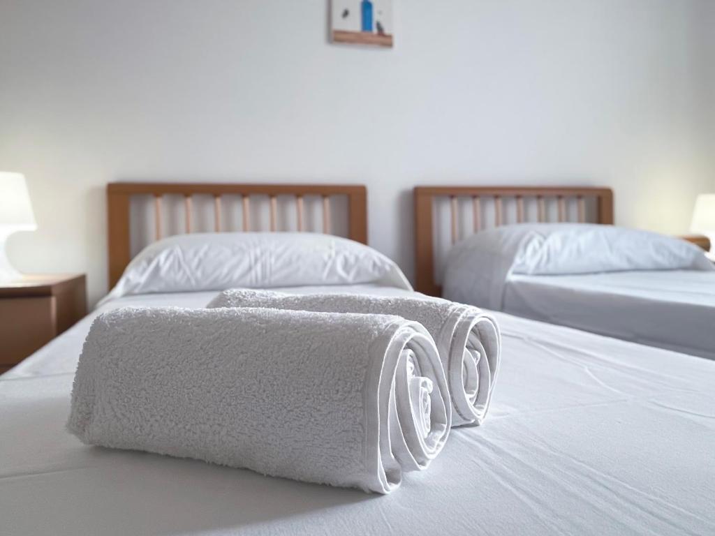 Postel nebo postele na pokoji v ubytování Villa Dino