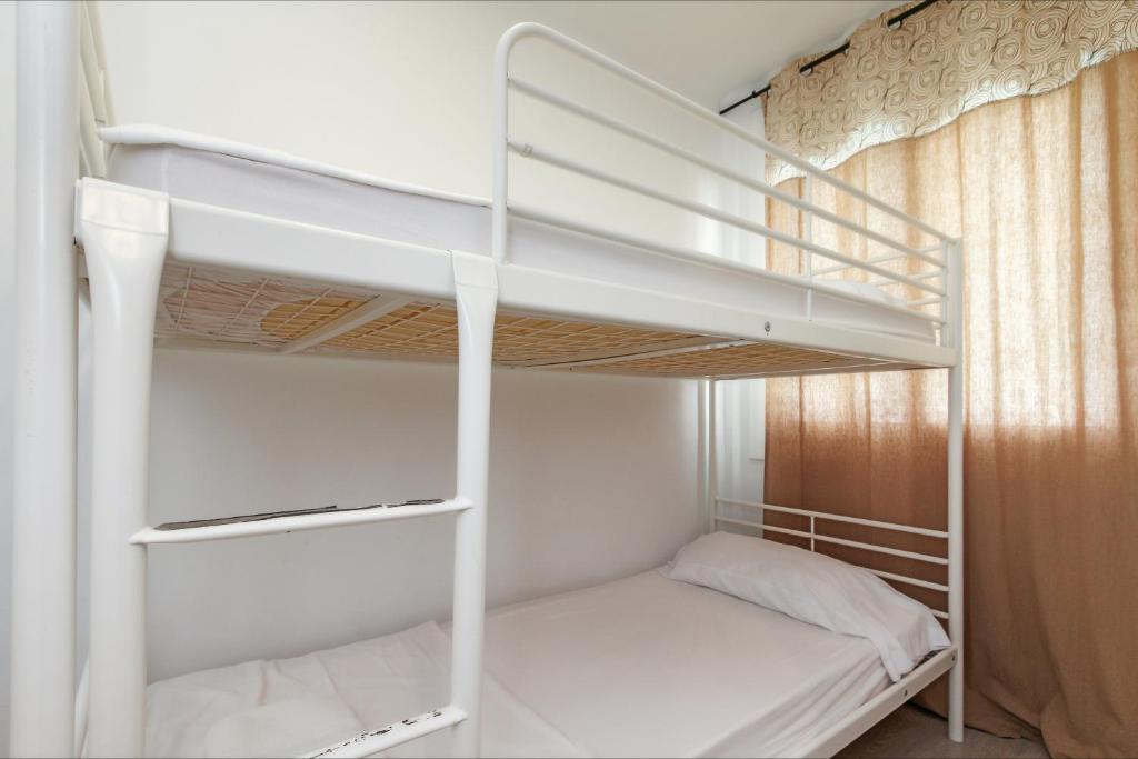 Postel nebo postele na pokoji v ubytování Apartamento Seven Seas