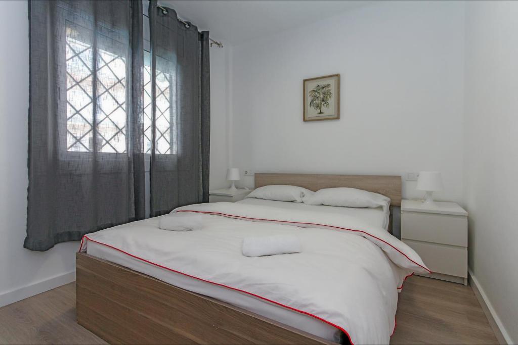 Postel nebo postele na pokoji v ubytování Apartamento Seven Seas