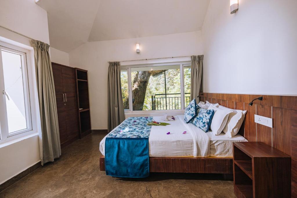 Postel nebo postele na pokoji v ubytování Elixir Woods Luxury Resort And Spa, Munnar