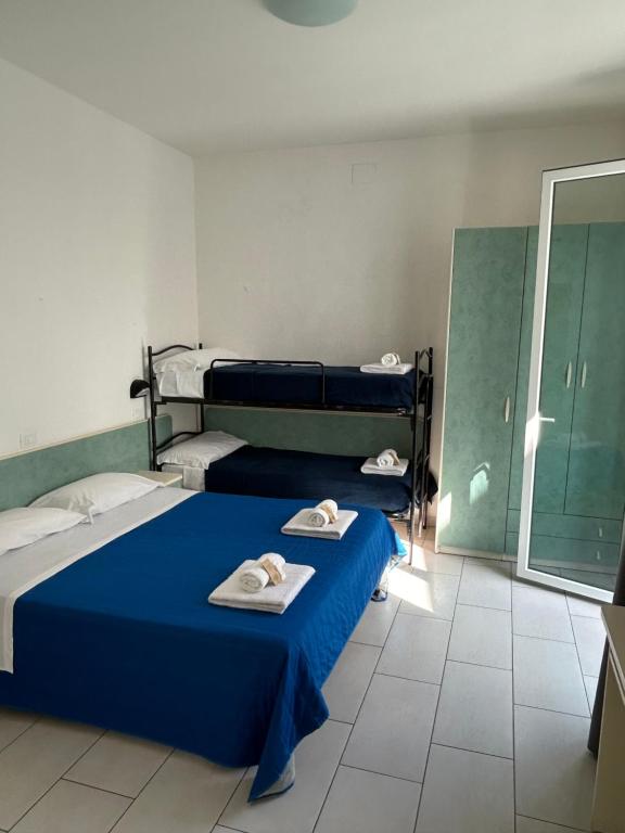 Postel nebo postele na pokoji v ubytování Hotel Zamagna