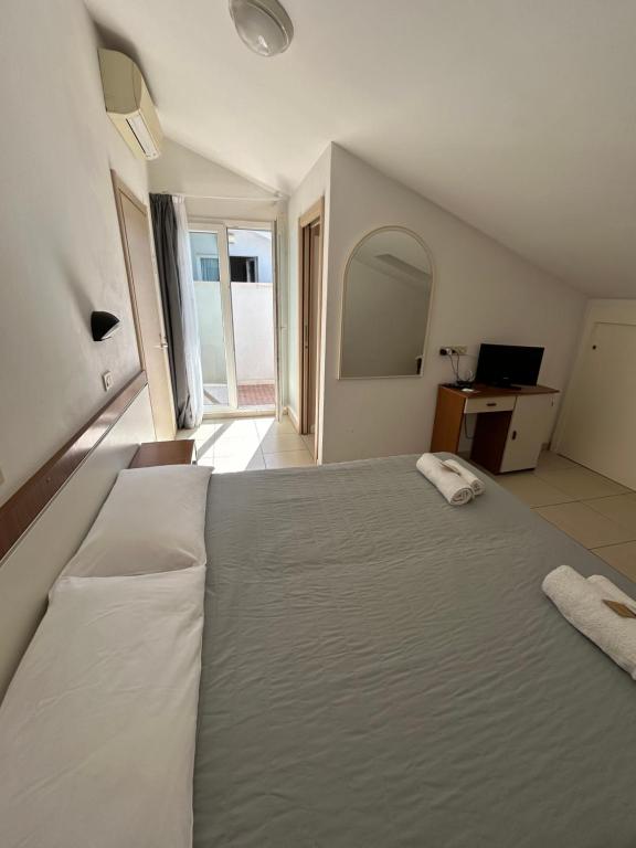 Postel nebo postele na pokoji v ubytování Hotel Zamagna