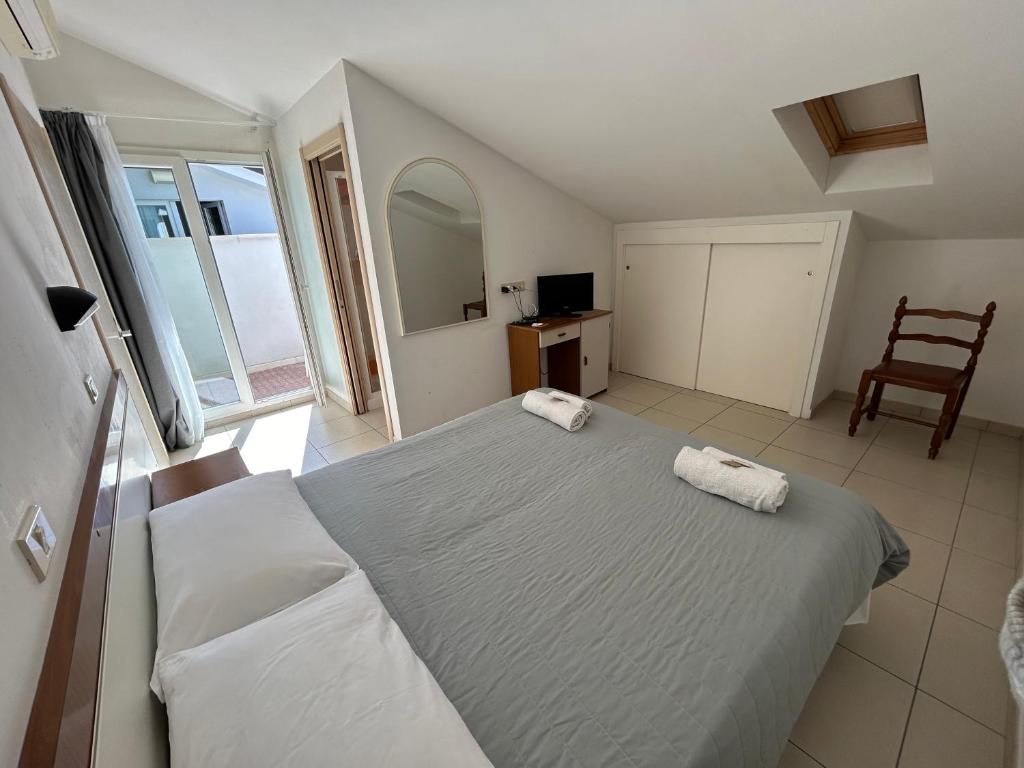 Postel nebo postele na pokoji v ubytování Hotel Zamagna