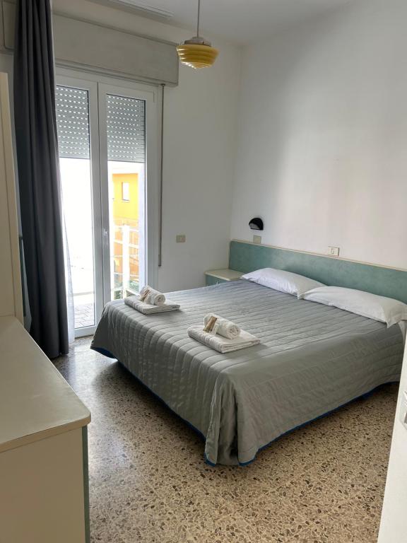 Postel nebo postele na pokoji v ubytování Hotel Zamagna