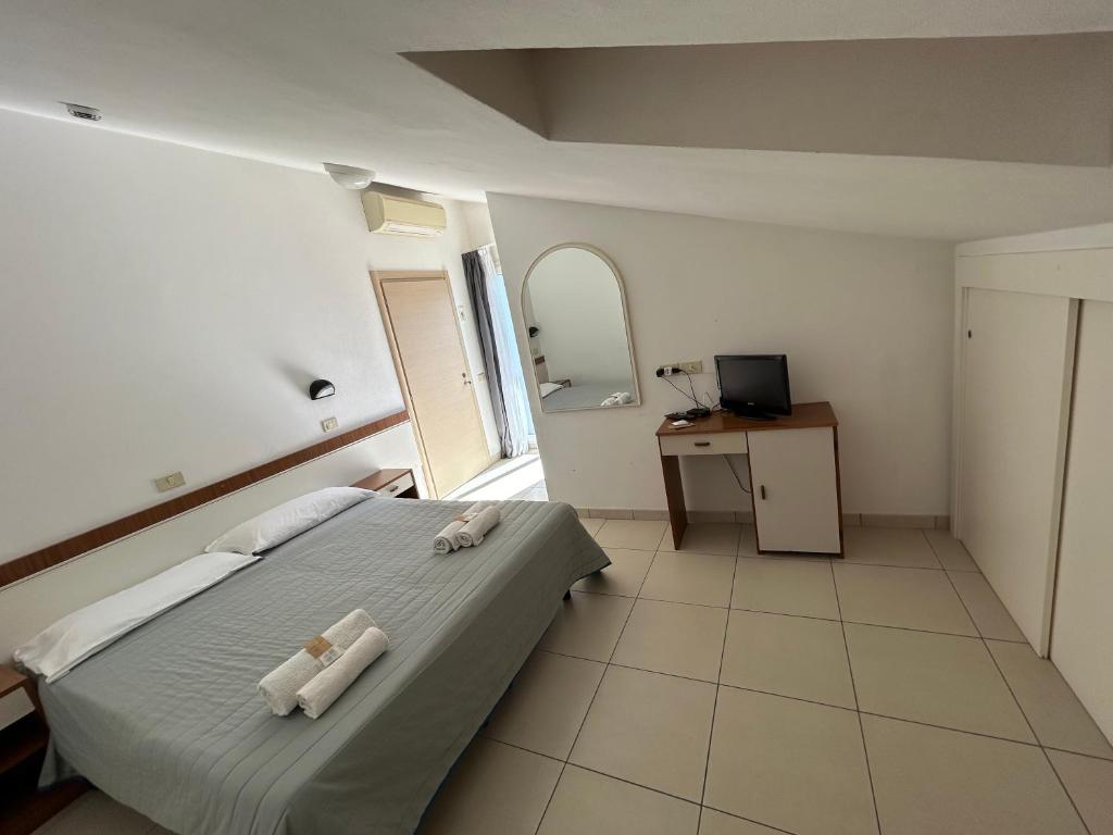 Postel nebo postele na pokoji v ubytování Hotel Zamagna