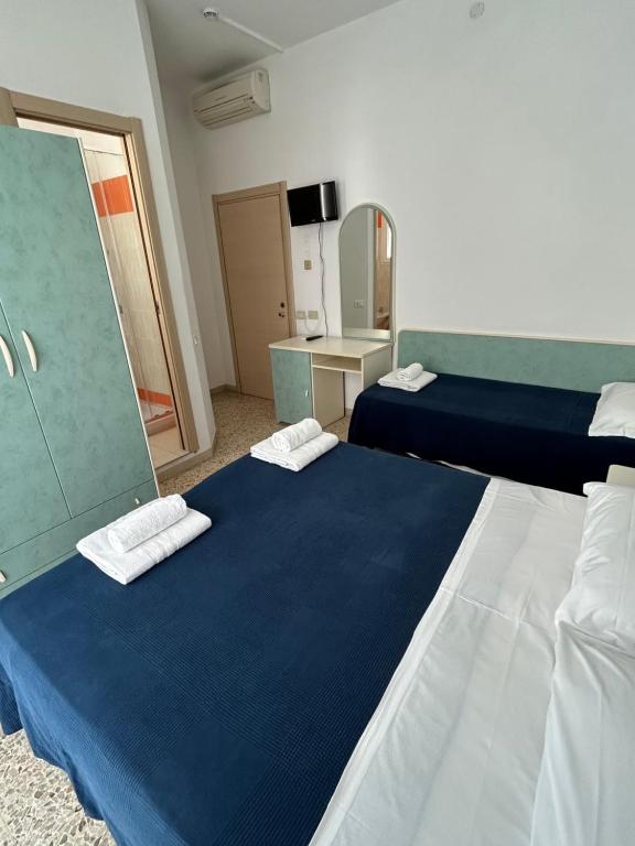 Postel nebo postele na pokoji v ubytování Hotel Zamagna
