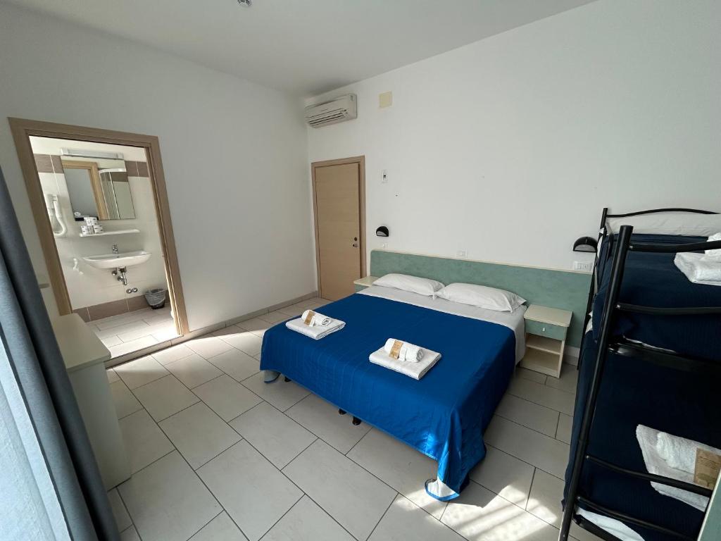 Postel nebo postele na pokoji v ubytování Hotel Zamagna