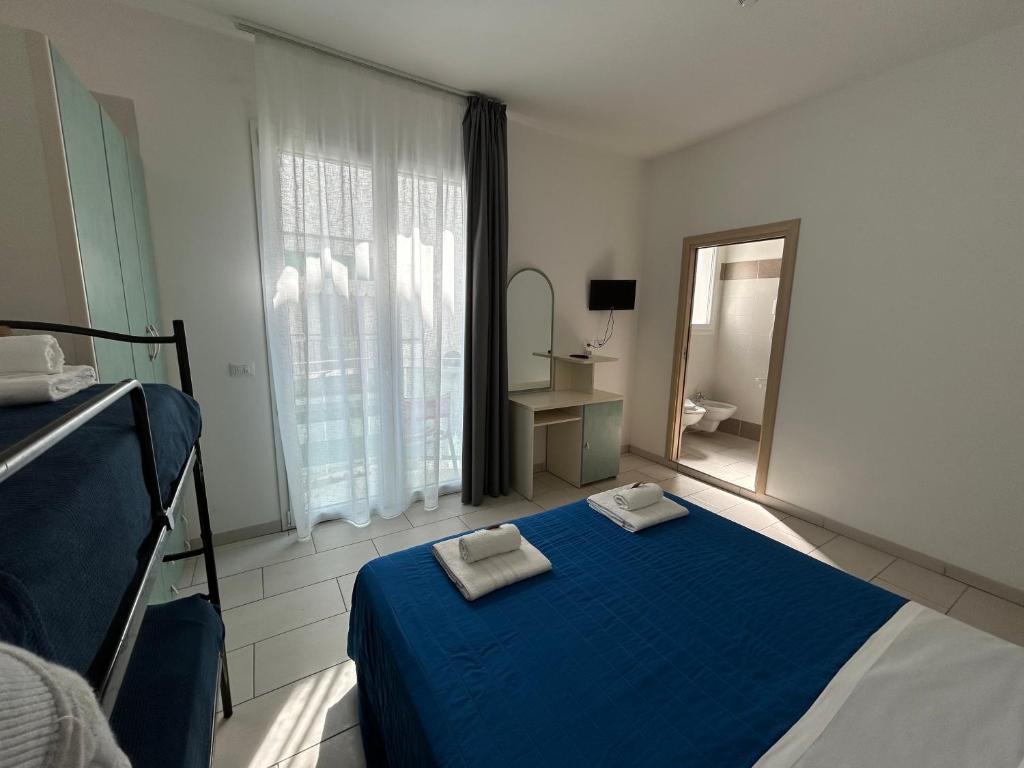 Postel nebo postele na pokoji v ubytování Hotel Zamagna