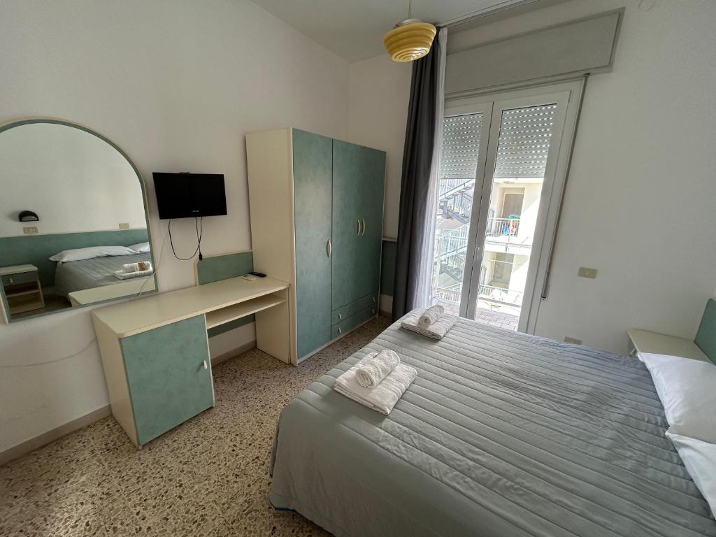 Postel nebo postele na pokoji v ubytování Hotel Zamagna