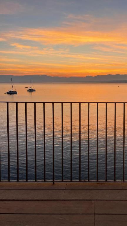 a view of the ocean with boats in the water at La Casetta sul mare in Castellammare del Golfo