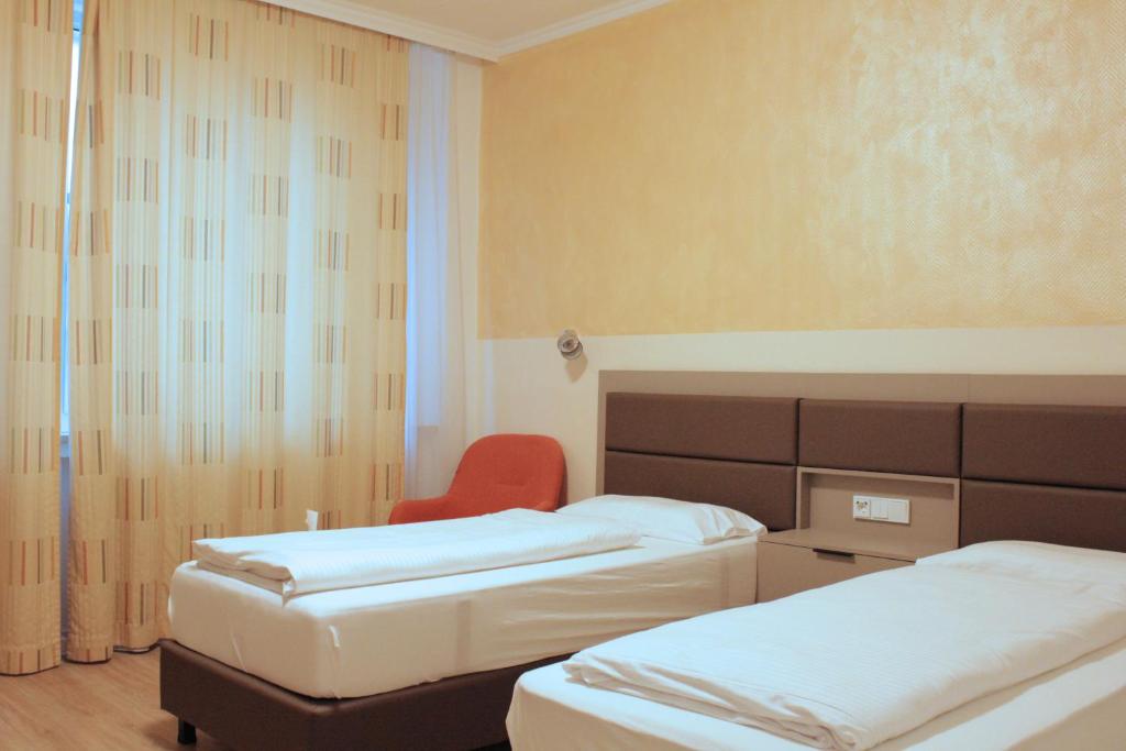 Postel nebo postele na pokoji v ubytování Isar City Hotel