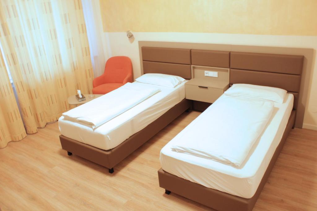 Postel nebo postele na pokoji v ubytování Isar City Hotel