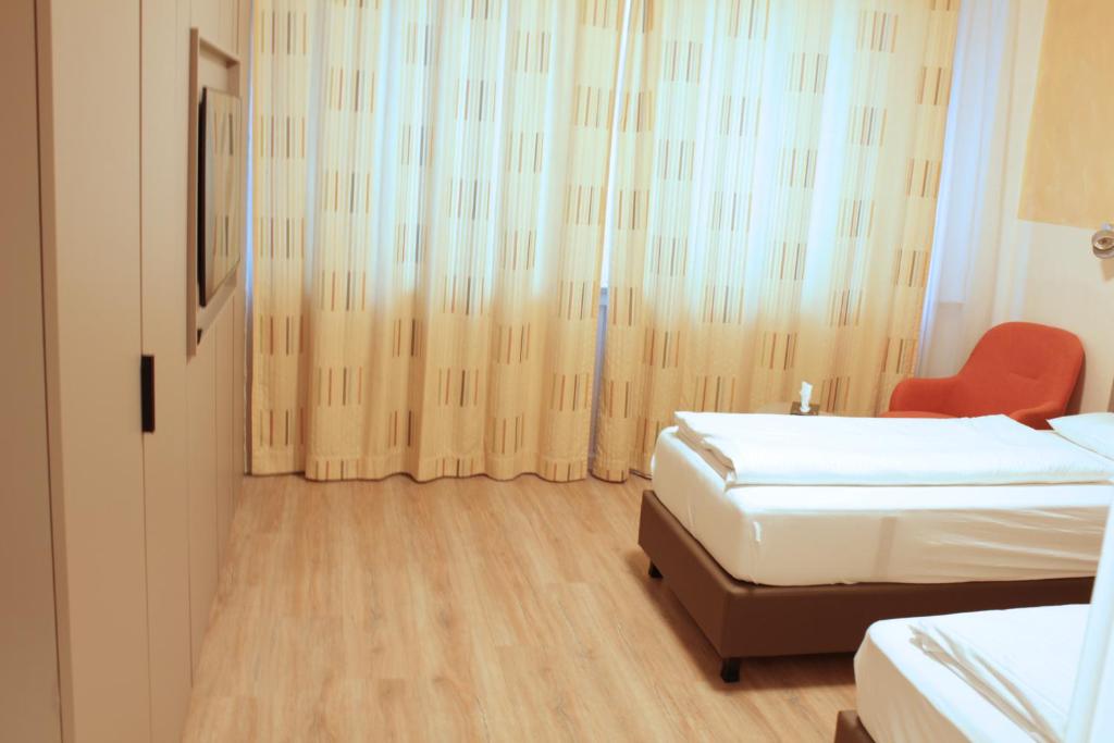 Postel nebo postele na pokoji v ubytování Isar City Hotel