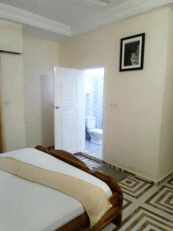 Postel nebo postele na pokoji v ubytování EKA ELITE HOTEL