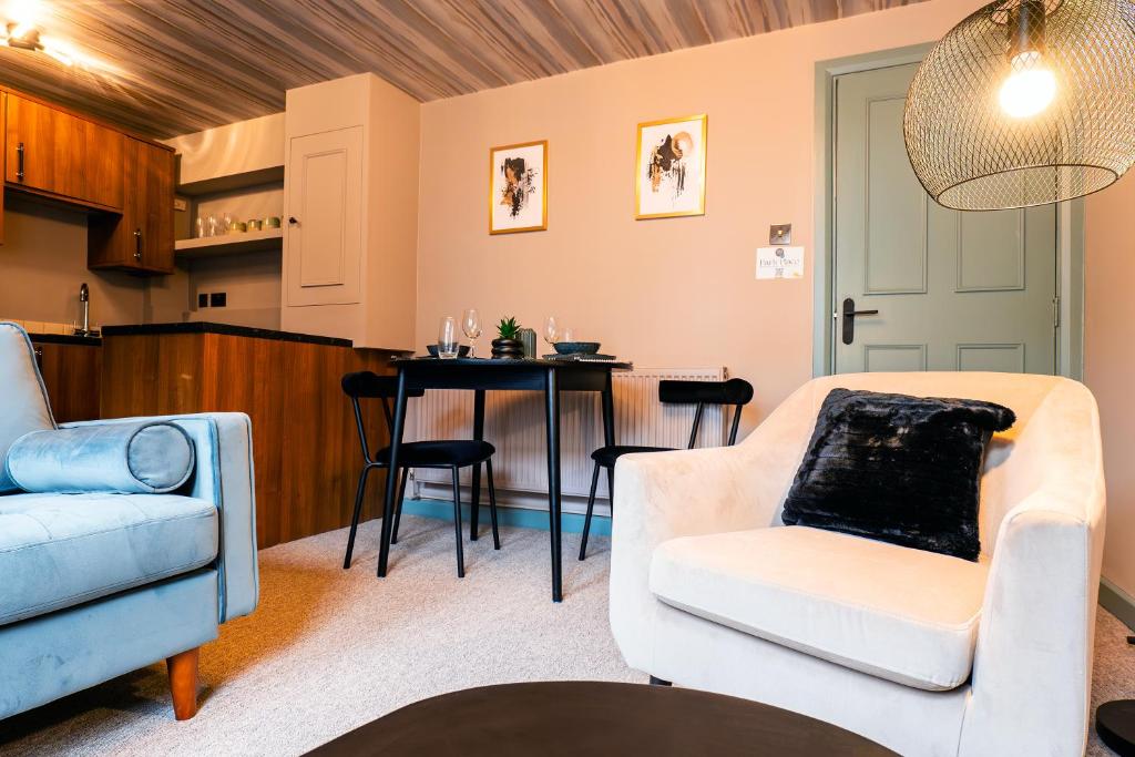 a living room with a couch and a table at Park Place - 1 Bedroom Apartment in Bristol by Mint Stays in Bristol