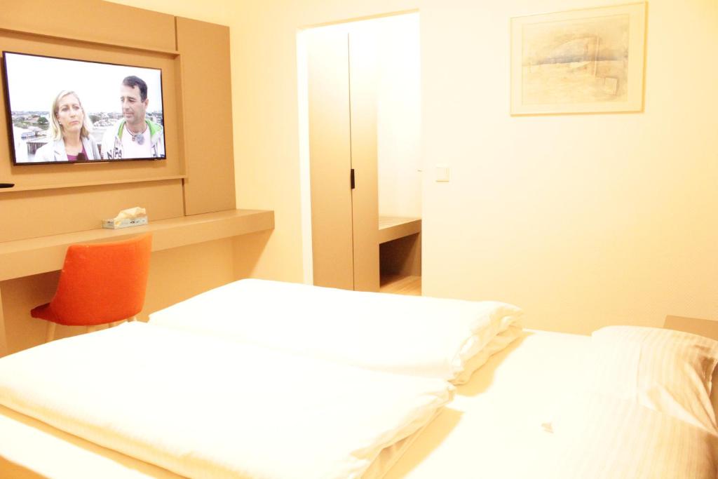 Postel nebo postele na pokoji v ubytování Isar City Hotel