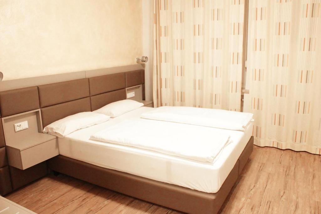 Postel nebo postele na pokoji v ubytování Isar City Hotel