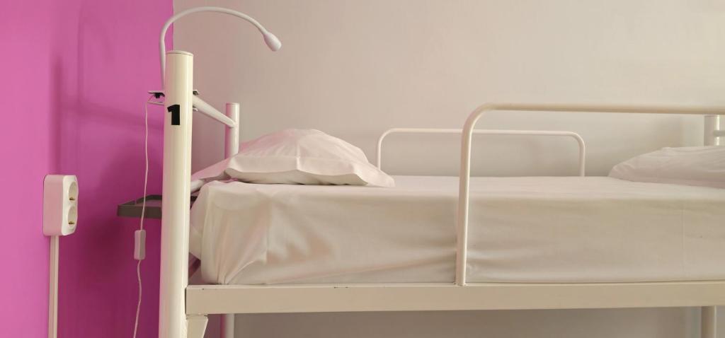 Postel nebo postele na pokoji v ubytování Santa Maria Hostel