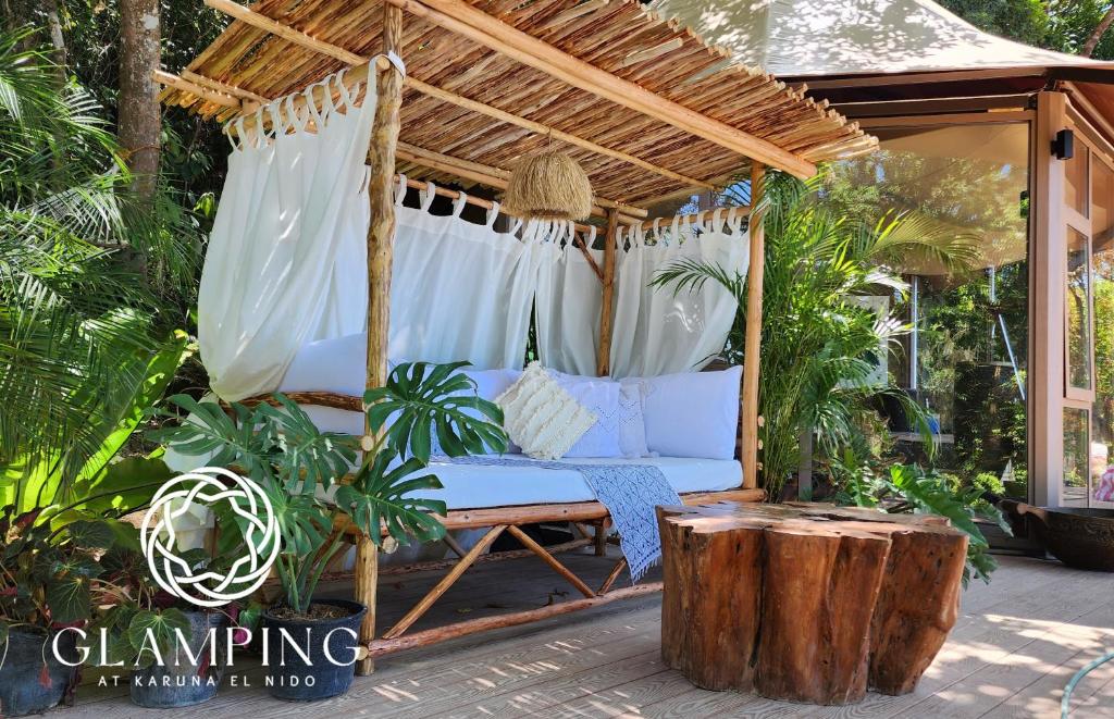 a gazebo with a white couch on a patio at Unique Stays at Karuna El Nido - The Jungle Lodge in El Nido