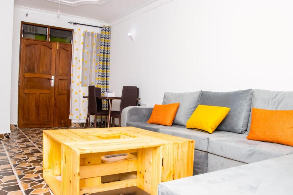 a living room with a couch and a coffee table at Powerground Resort in Nairobi