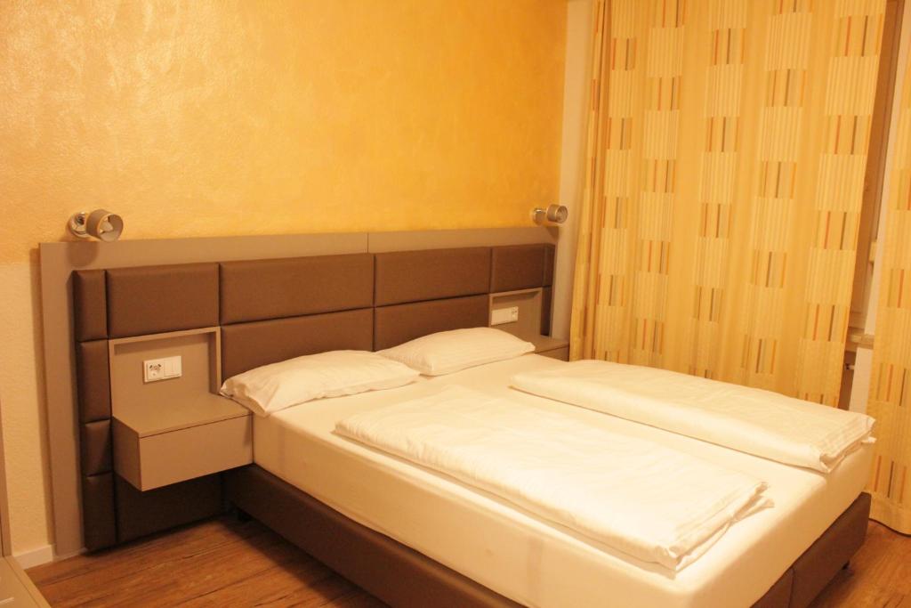 Postel nebo postele na pokoji v ubytování Isar City Hotel