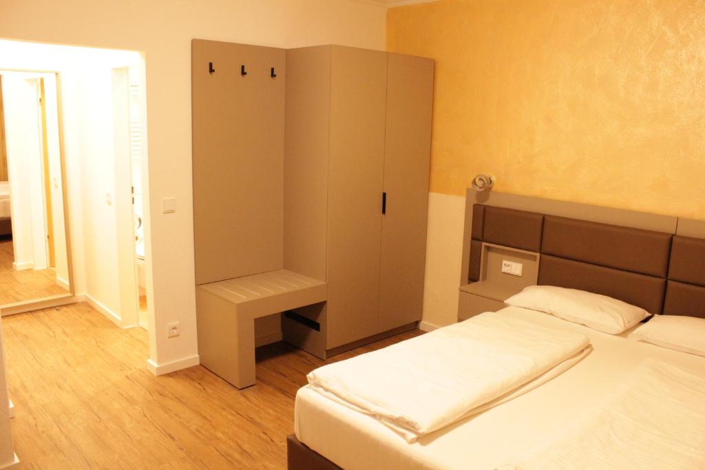 Postel nebo postele na pokoji v ubytování Isar City Hotel