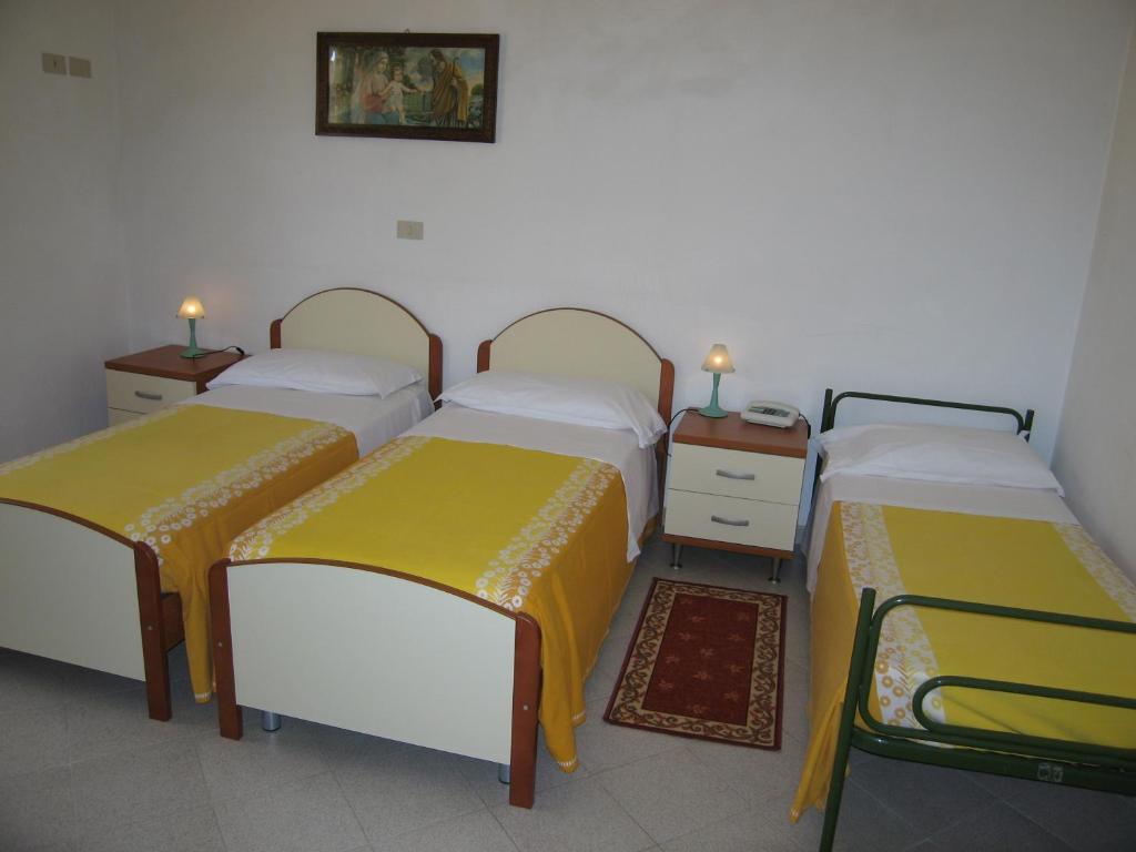 Postel nebo postele na pokoji v ubytování Albergo Natucci
