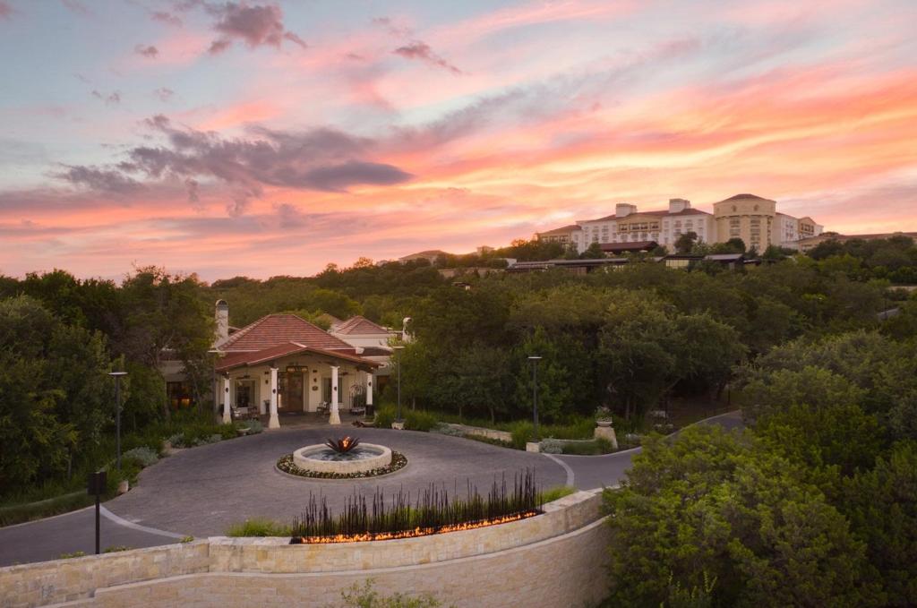 a house with a fountain in the middle of a driveway at Villas at La Cantera Resort & Spa in San Antonio