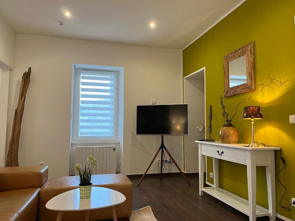 TV a/nebo společenská místnost v ubytování Ferienwohnung1 Daun