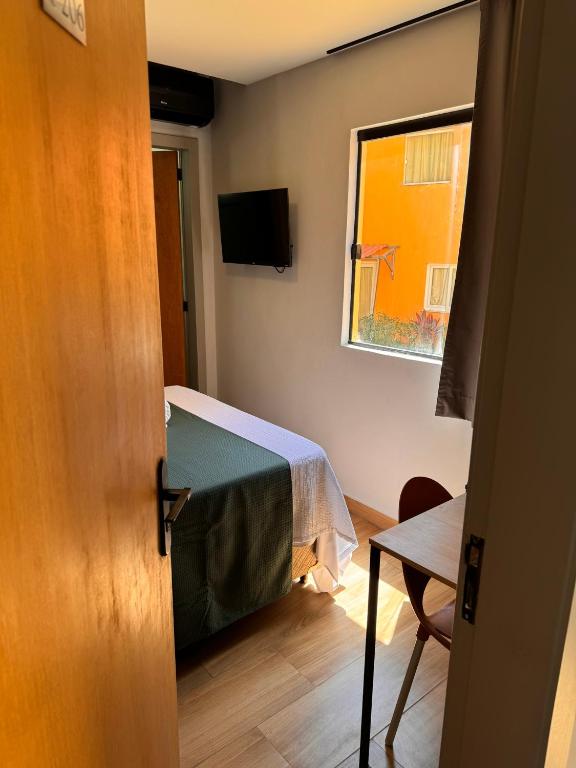 TV a/nebo společenská místnost v ubytování Hotel Caitá