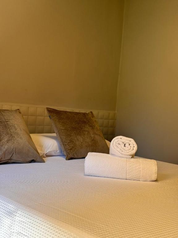 Postel nebo postele na pokoji v ubytování Hotel Caitá