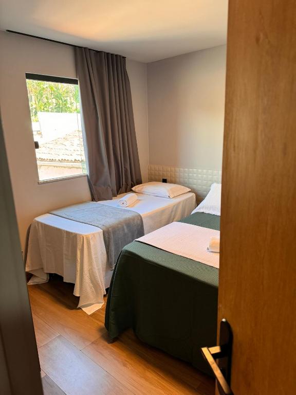 Postel nebo postele na pokoji v ubytování Hotel Caitá