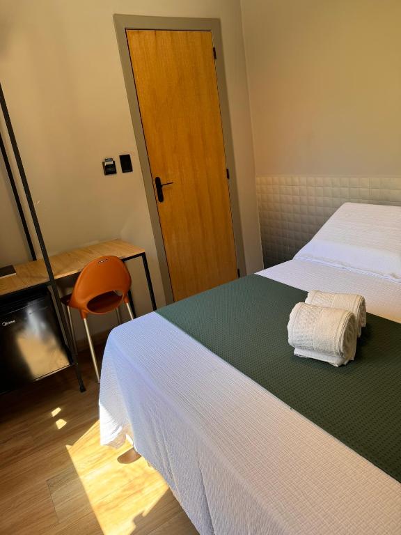 Postel nebo postele na pokoji v ubytování Hotel Caitá