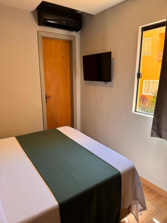 TV a/nebo společenská místnost v ubytování Hotel Caitá