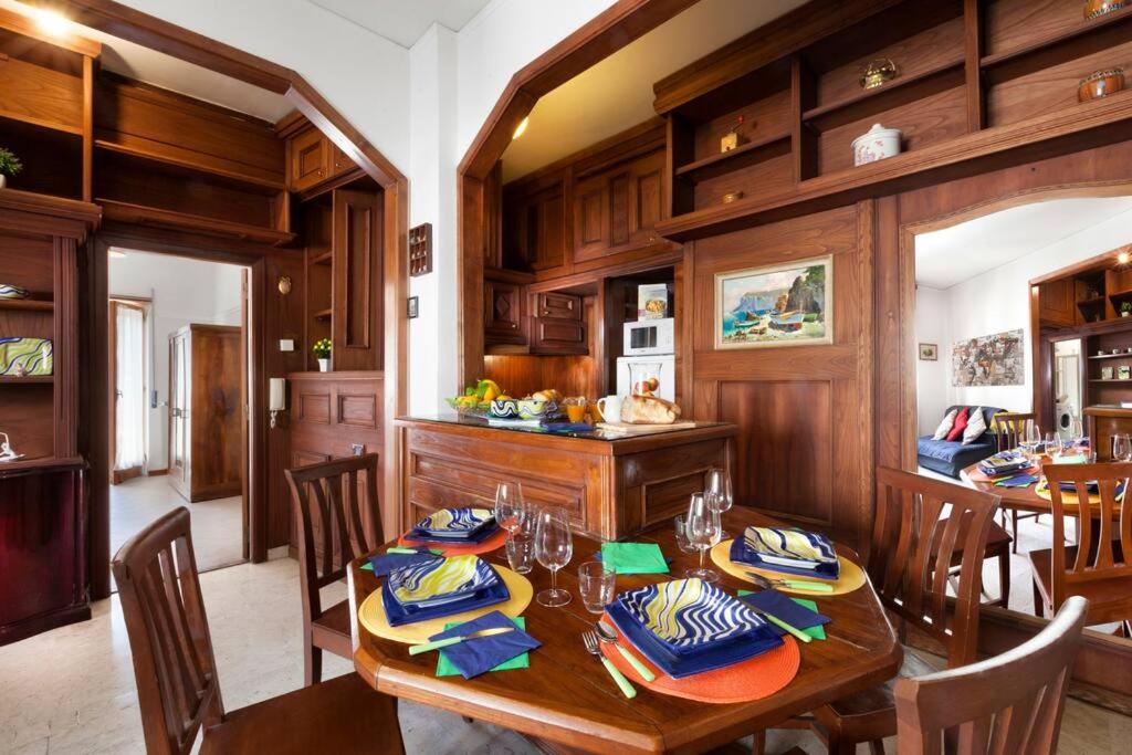 a kitchen and dining room with a table and chairs at Maison Alessia - Around Sorrento in Sorrento