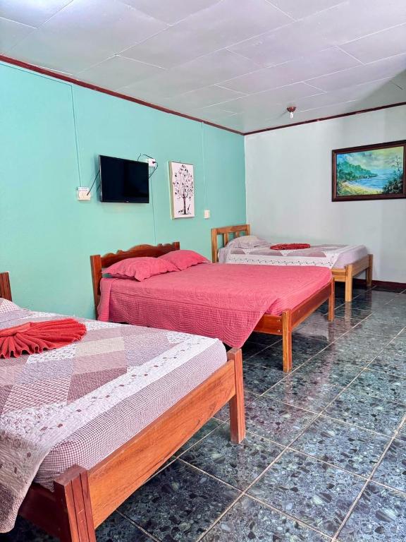 Postel nebo postele na pokoji v ubytování Hotel El Chaman