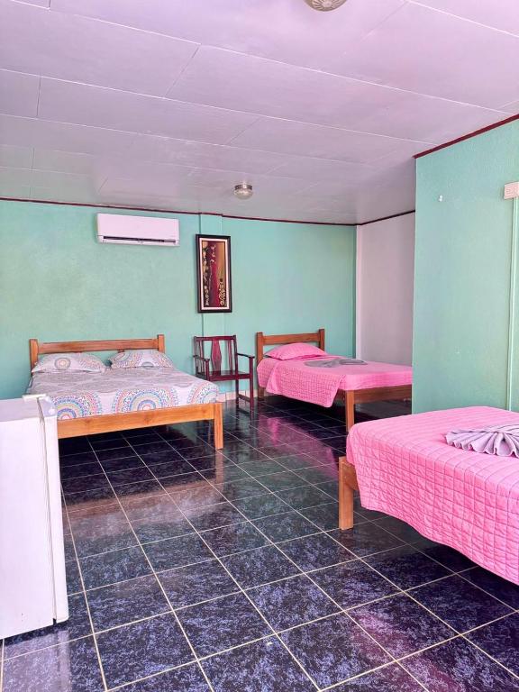 Postel nebo postele na pokoji v ubytování Hotel El Chaman