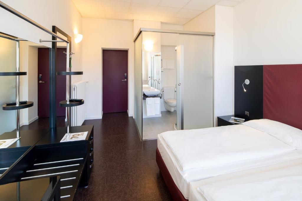Uma cama ou camas num quarto em Hotel Rio Muralto