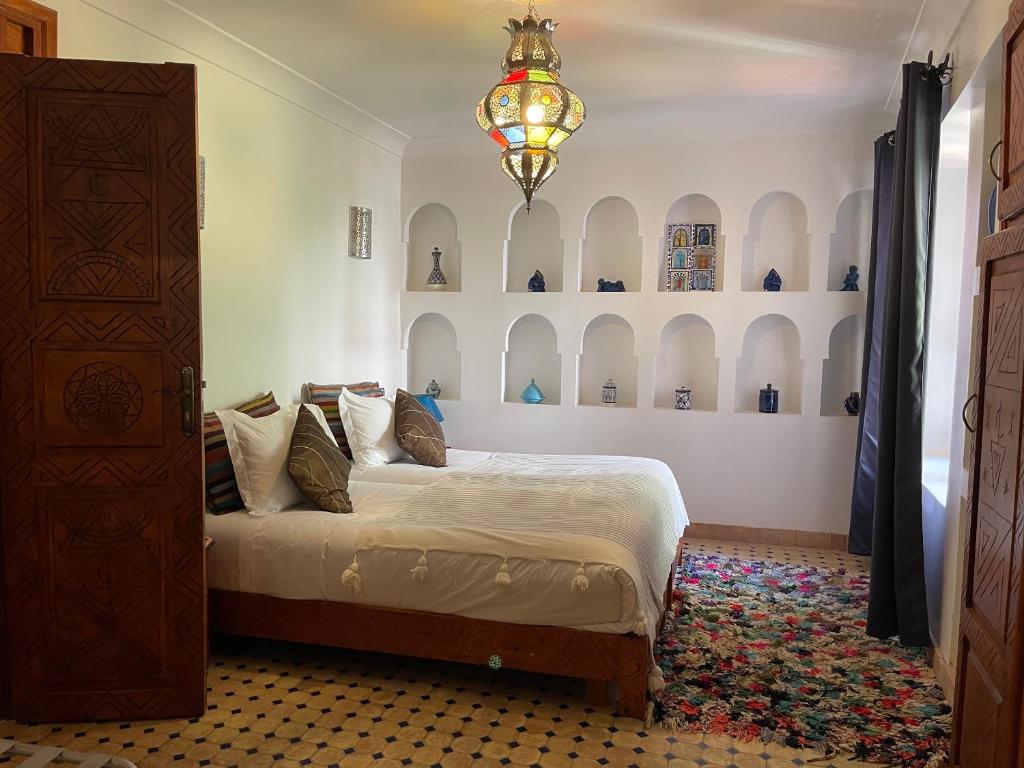 Letto o letti in una camera di Riad Tafilag