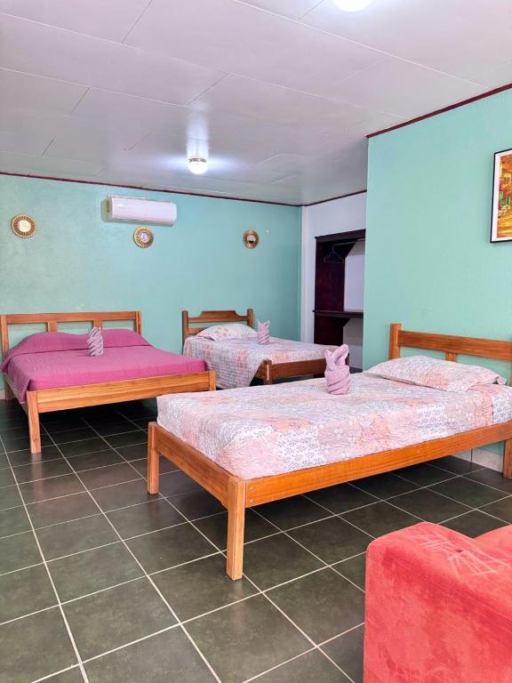 Postel nebo postele na pokoji v ubytování Hotel El Chaman