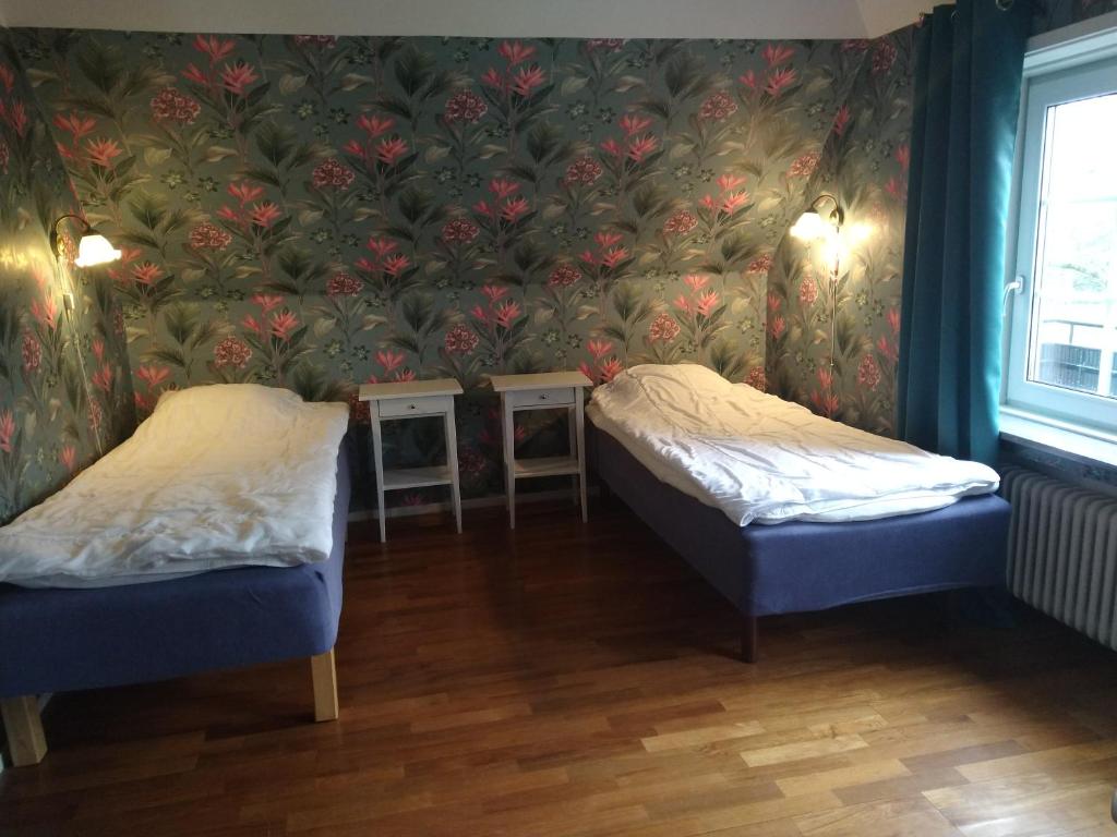 Postel nebo postele na pokoji v ubytování Villa Signedal Hostel