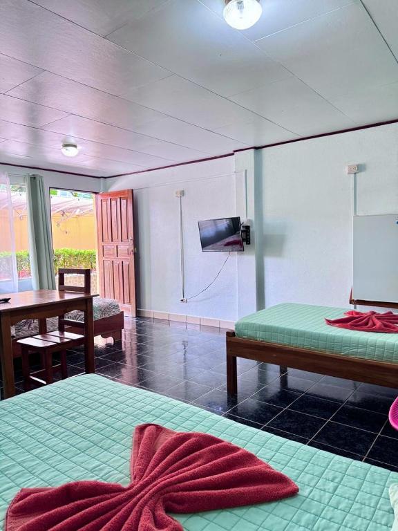 Postel nebo postele na pokoji v ubytování Hotel El Chaman