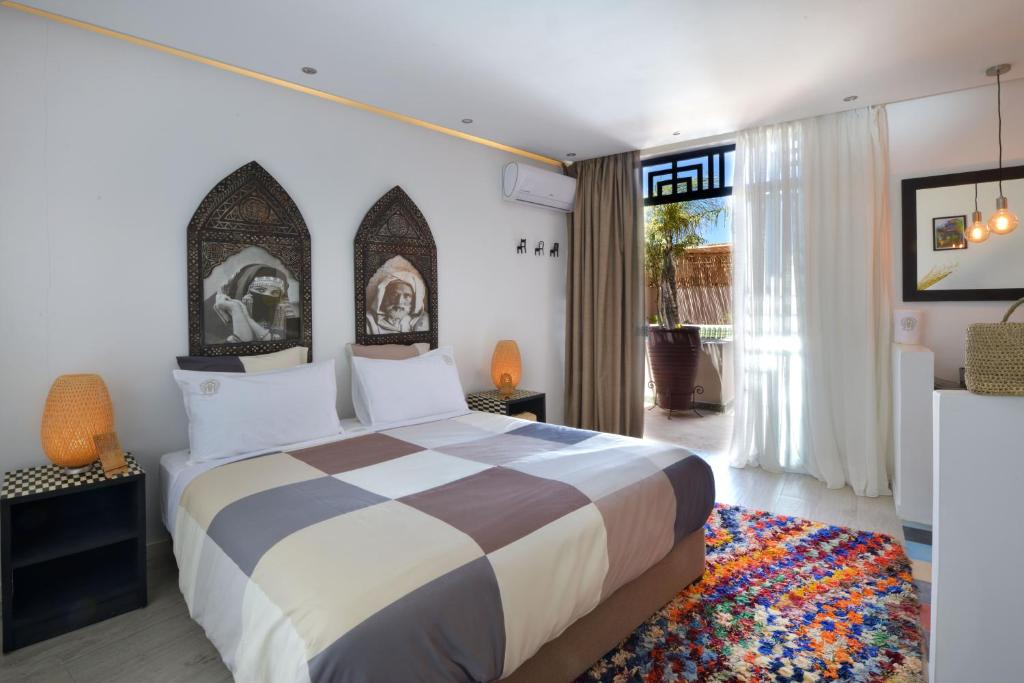 Postel nebo postele na pokoji v ubytování Riad Palau Marrakech